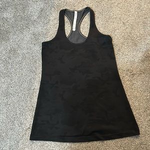 Women’s  Lululemon racerback tank in a black camouflage print. Size 10.